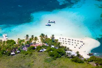 The beach on the western tip of Pinel Island, jutting into Cul-de-Sac Bay, illustrates the more unspoilt nature of St Martin
