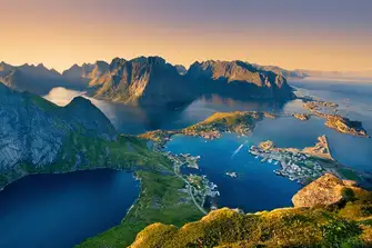 The midnight summer sun casts a golden light over the Lotofen Islands