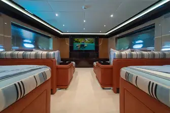 The lower deck cinema room has large loungers on which guests can enjoy movies