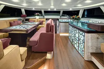 The agate-inlaid tables lower to create a coffee lounge