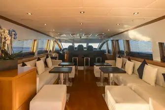 Looking forward towards the sit-up bar and bridge. Steps to the lower deck accommodation are to starboard of the bar
