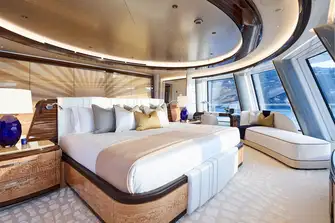 The master suite bedroom is forward on a private deck with spectacular views