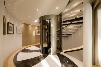 The glass-and-steel elevator serves all guest decks, lower to sun decks