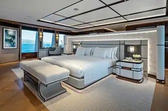 The owner's suite looks aft over a private terrace on the bridge deck