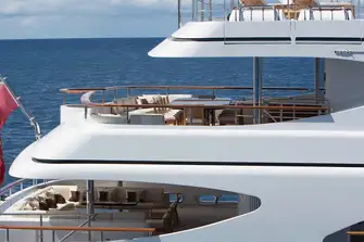 Open-air dining on the bridge deck and lounge seating on the main deck