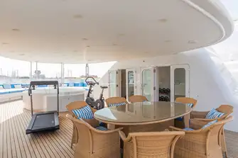 Foward there is seating, a jacuzzi, dining table, dayhead and jacuzzi equipment