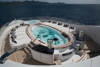 The sun deck's 7.5m (24.6ft) oval pool, jacuzzi forward and waterfall feature aft
