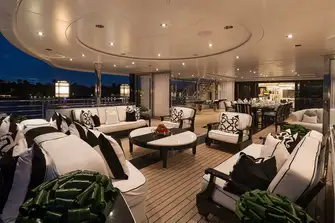 The 'winter garden' dining area, seen to the right, has sliding glass walls for dining inside or out as required