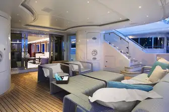 A comfortable lounge area on the main deck aft, shaded by the overhang