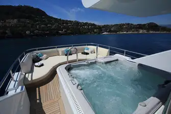 Aft is a raised jacuzzi and a bank of sunpads