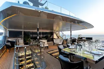 An impressive al fresco dining arrangement on the upper deck aft
