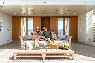 The transom folds down to reveal a spacious beach club with a large swim platform