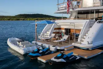 The large swim platform and beach club, with tender and toys from the lower deck garage