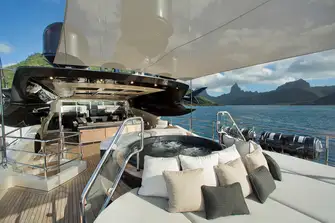 Flybridge sun deck covered seating and jacuzzi