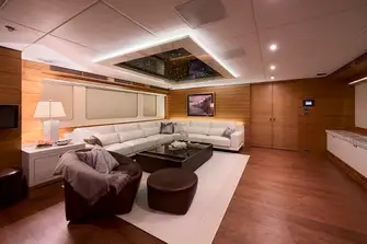 The main saloon has L-shaped sofa seating forward to port
