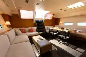 Looking aft in the saloon with lounge and dining areas