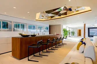 The beach club links the swim platform to the pool, wellness spa and gym