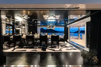 Spectacular views through full height windows from the upper deck's formal dining room