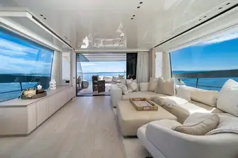 An open-plan main saloon has huge windows