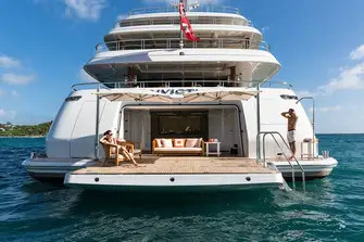 Full-beam tender garage which opens up to port and starboard for launching tenders and toys