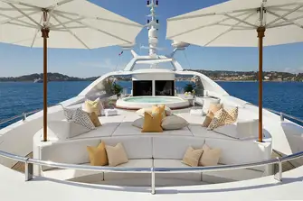 Seating, sun pads and a large jacuzzi with swim up bar on the sun deck