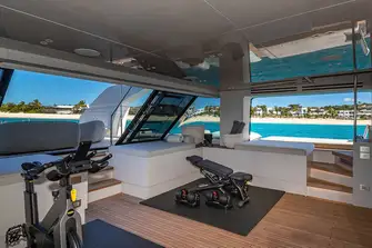 Folding sea terraces extend beyond the swim platform, opening up the beach club, and the glazed transom presents wraparound sea views