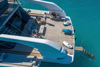 The huge swim platform serves as tender and toy stowage underway, recovered with a cleverly concealed deck crane
