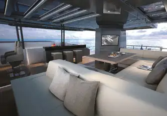 Just after of the flybridge helm station is a bar, dining and dayhead