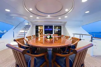 Open air dining on the bridge deck aft