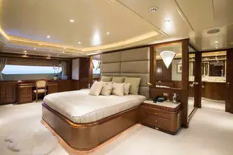 The berth in the full beam owner's suite faces aft, with the bathroom behind it