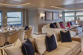 The owner's saloon with dining inside and out and multiple lounge areas