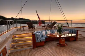 A seating area for informal dining and drinks and a raised sun lounge area aft