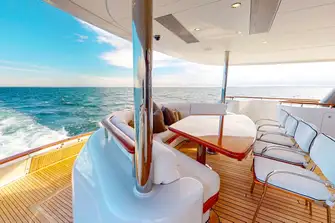 The main deck aft lounge and steps leading down to the swim platform with its folding section