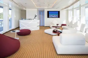 The sky lounge has teak decking and full-height windows to bring the outside inside