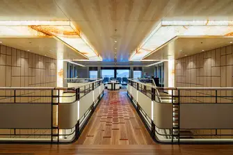 Looking aft on the upper deck past the two atriums