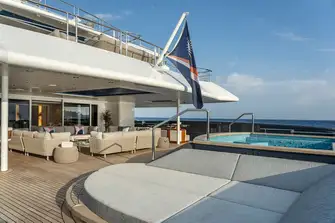 Large pool and lounge on the main deck aft
