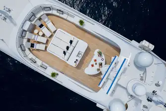 An expansive sun deck with daybed, bar and plenty of seating to take in the views