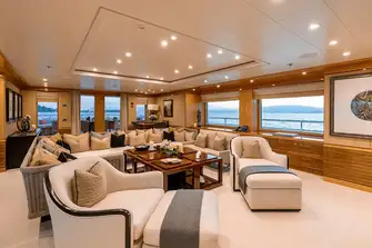 Seating in the sky lounge faces a large TV screen on the forward bulkhead