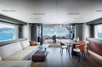Looking aft in the sky lounge, out to the al fresco dining on the bridge deck aft