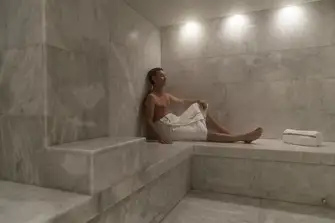 The wellness area has a steam room, massage room, shower and dayhead