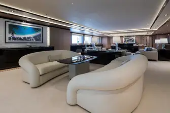 Looking forward in the main saloon across a cosy lounge, larger lounge and formal dining forward