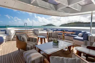 Lounge area forward of the bar beneath the glazed hardtop