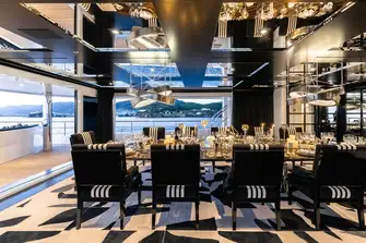 Her dining room achieves space and intimacy in any weather and it delivers privacy too as it can't be seen from the dock